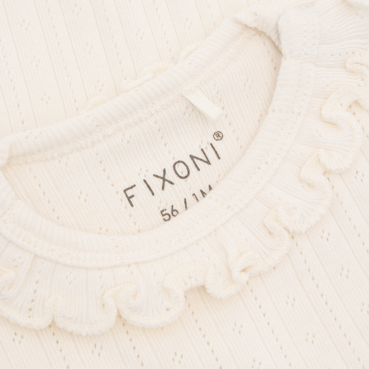 Fixoni - Creme body med flæsekant 423137